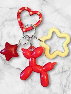 Red Balloon Dog Keyring Toy with Star and Flower Charms